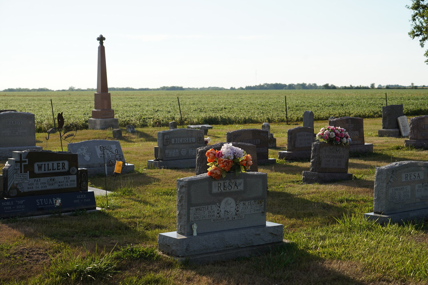 The sun shines after a storm, in St. Michael Cemetery in Hager's Grove.
